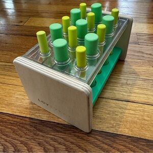 Lovevery Wooden Peg Board with Green and Yellow Pegs